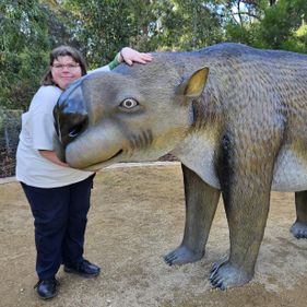 Bronwyn Saunders with a Diprotodon sculpture