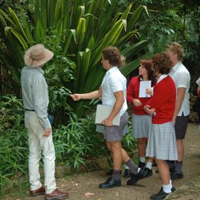 Secondary school students investigating native plants.