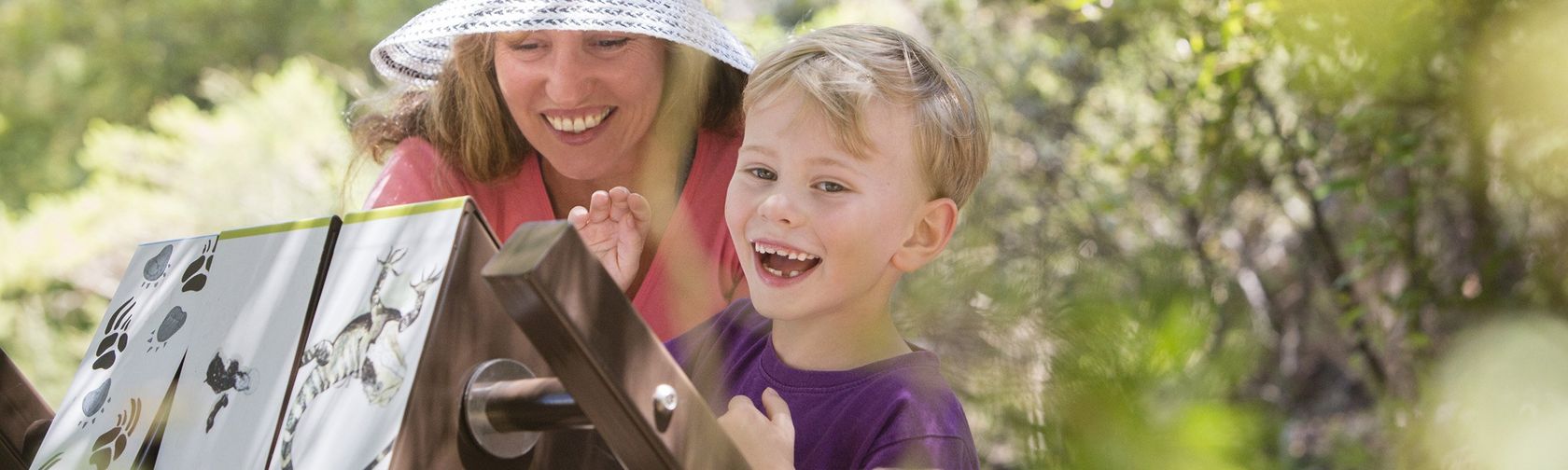 Mother and son enjoying one of the activity stations along the Who Did That? Children's Trail