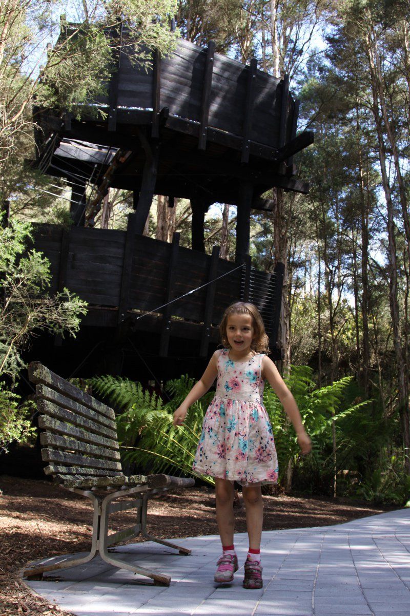 Paper bark treehouse and girl.